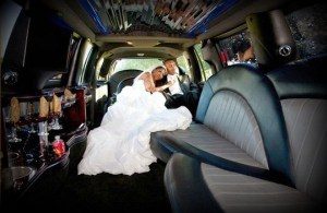 Image of bride and groom in a CT limousine