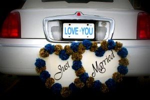 Image of back of white limousine with the words just married and a license tag that says love you