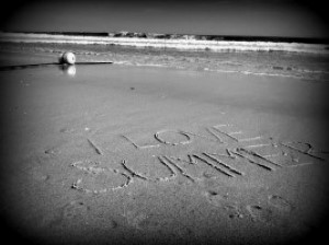 Image of I love summer written in the sand at the beach